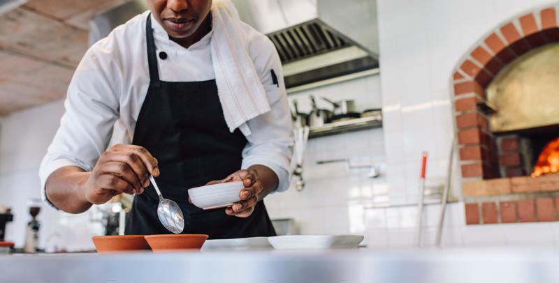 A chef working in a kitchen.