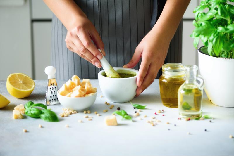 A chef making a homemade condiment.