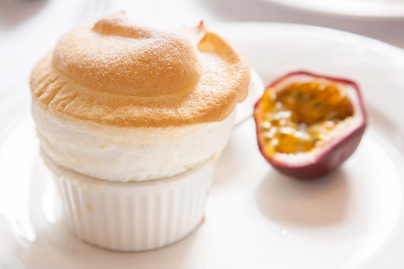 A passion fruit dessert in a small ramekin.