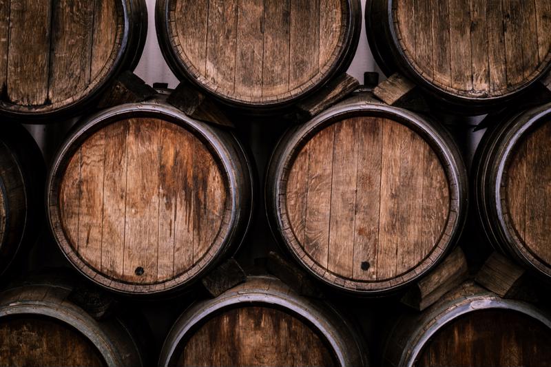 A front view of a stack of wine barrels.